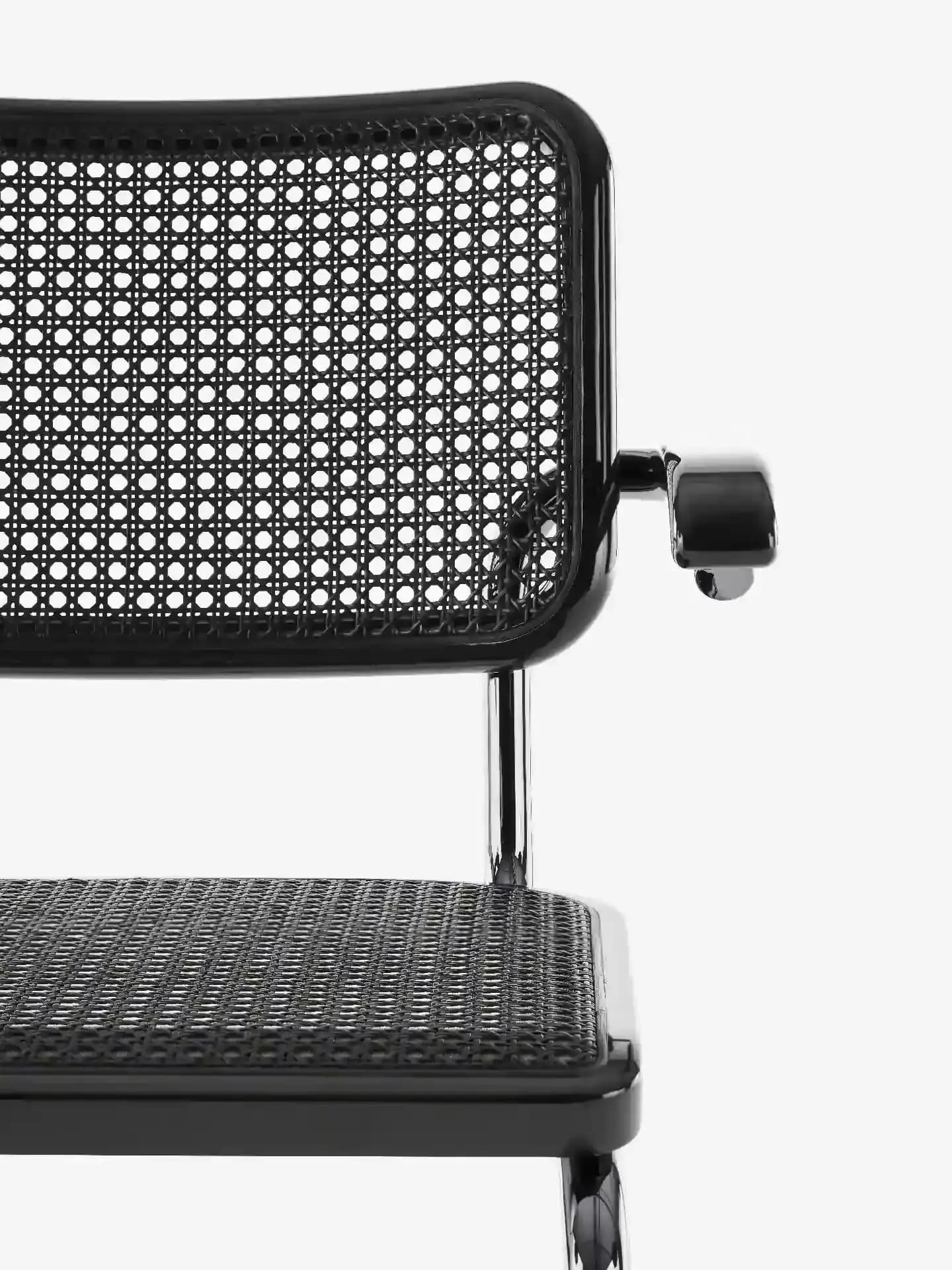 Detail shot JS . Thonet cantilever chair S64 of the SERIOUS 05 edition in titanium graphite black glossy with wickerwork in dark melange high gloss.